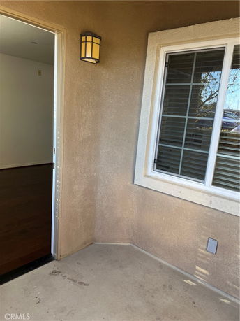 Exterior corner view with door and window.