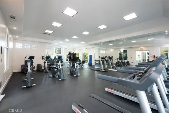 Interior view of a gym with treadmills and exercise equipment.