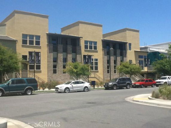 Front view of a multi-story building with modern architecture.