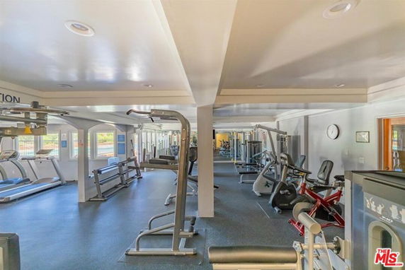 Interior view of a gym area with exercise equipment.