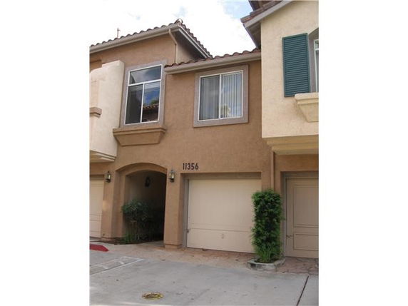 Front view of a two-story house with a double garage.