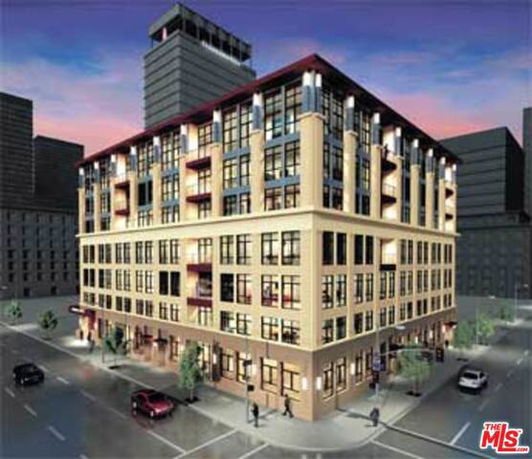 Front view of a multi-story building on a street corner.