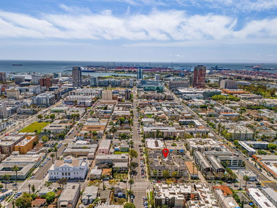 Panoramic view of a cityscape with a harbor in the distance.