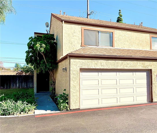 Front view of a two-story house with a double garage.