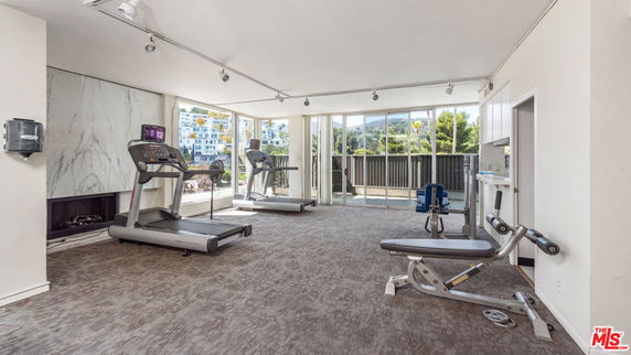Indoor gym area with treadmills and exercise equipment.