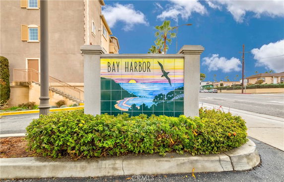 Front view of a building with a sign that says 'Bay Harbor.'