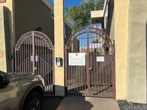 Front view of a building with gated entrance.