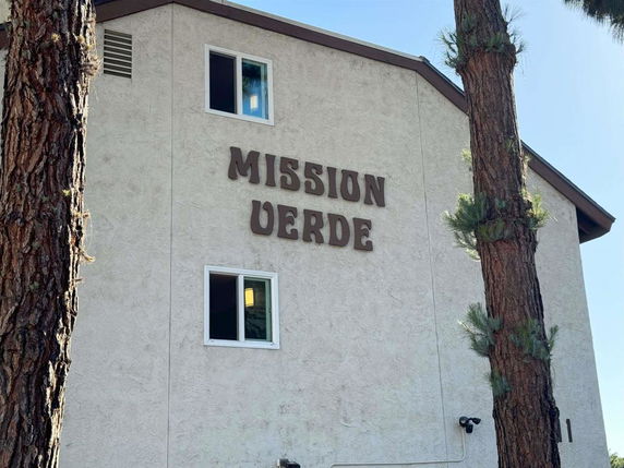 Front view of a building with the name 'Mission Verde' on the facade.