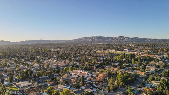 Wide angle view of a suburban area with mountains in the background.