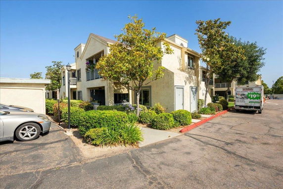 Front view of a two-story residential building with balconies.