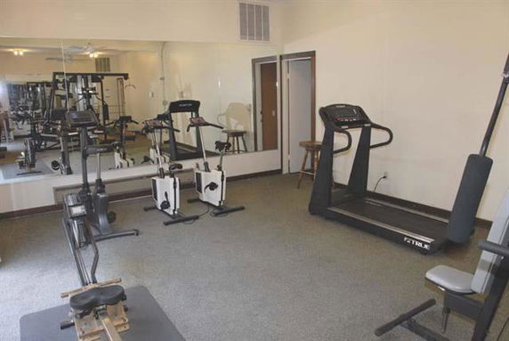 Indoor gym area with exercise equipment.