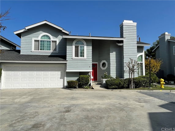 Front view of a two-story house with a double garage.