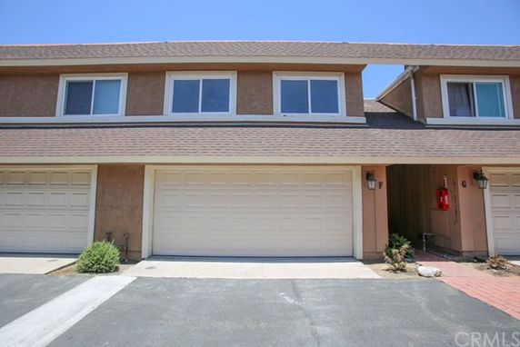 Front view of a two-story house with a double garage.