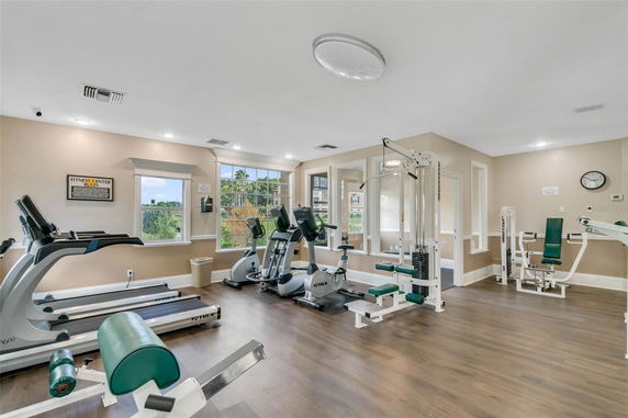 Gym area with various exercise machines and equipment.