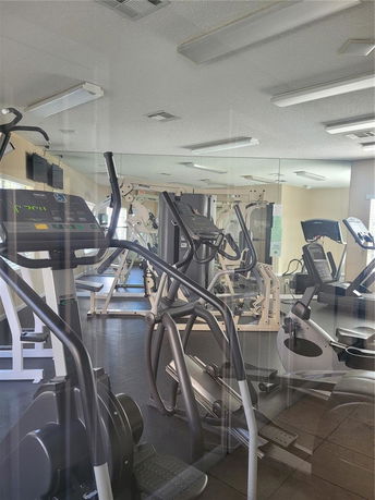 Interior view of a gym with exercise equipment.