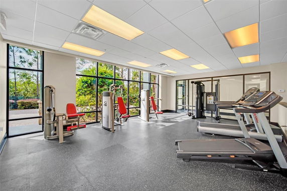 Interior view of a gym area with exercise machines and treadmills.