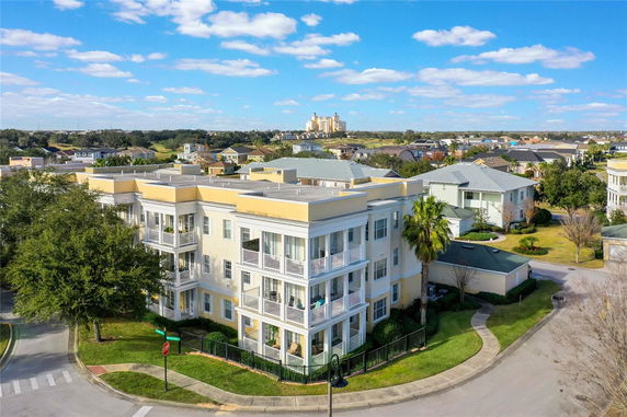Front view of a multi-story building with balconies.