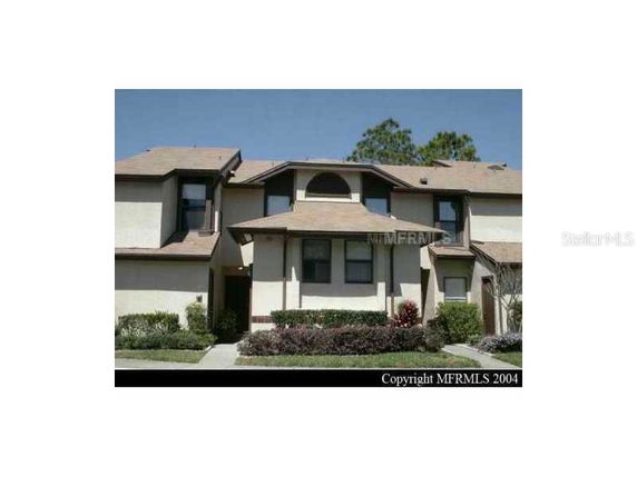Front view of a two-story townhouse with gabled roof.