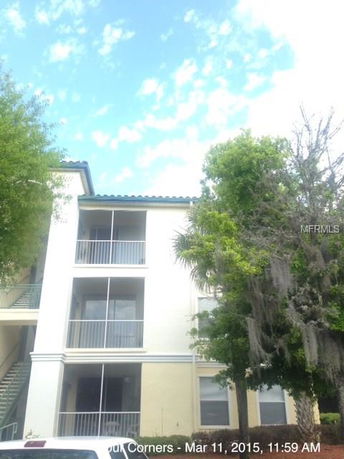 Front view of a multi-story building with balconies.