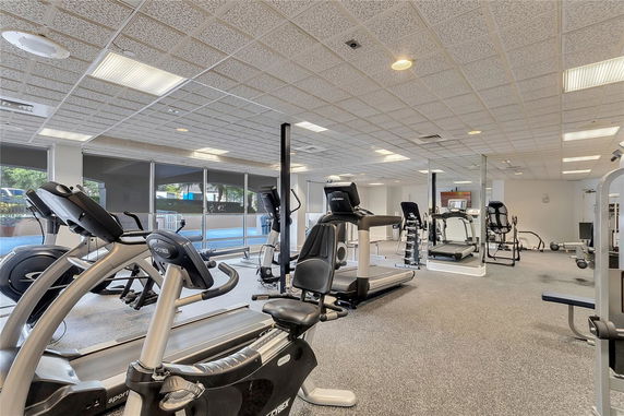 Interior view of a gym area with various exercise equipment.
