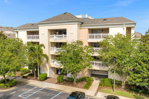 Front view of a multi-story residential building with balconies.