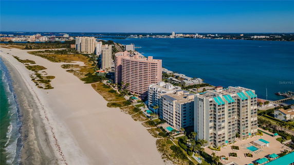 Aerial view of beachfront buildings overlooking the ocean.