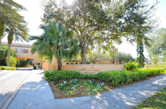 Front view of a residential entrance with archways.