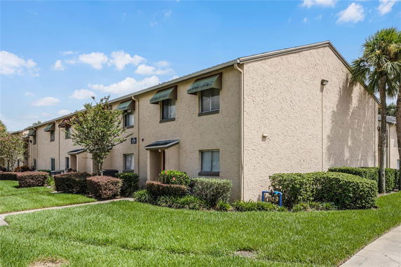 Front view of a two-story residential building with multiple units.