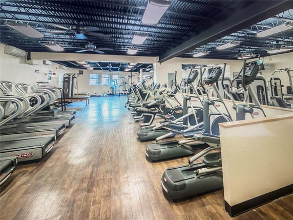 Indoor gym area with treadmills and exercise equipment.