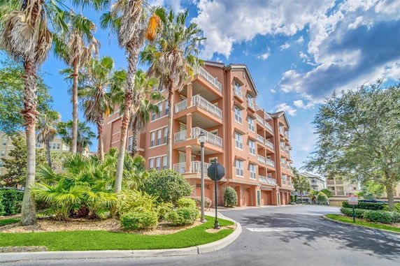 Front view of a multi-story residential building with balconies.