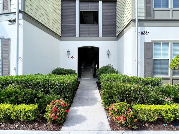 Front view of a building with an entrance walkway and stairs.