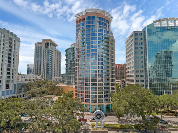 Front view of a modern high-rise building with glass facade.