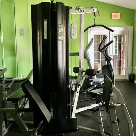 Indoor gym area with exercise equipment.