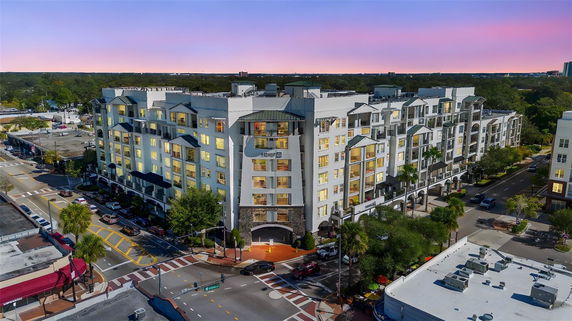 Front view of a multi-story apartment building in an urban area.