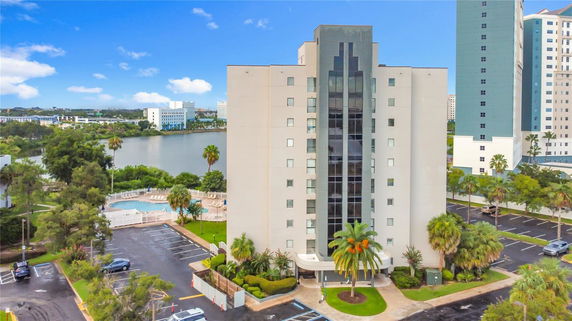 Front view of a multi-story building with a symmetrical design and light-colored facade.
