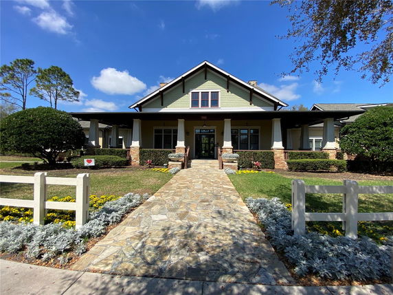 Front view of a house with a stone walkway and a covered porch.