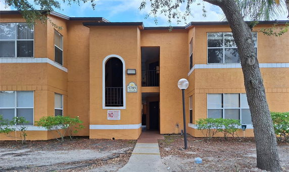 Front view of a two-story apartment building with a central entrance.