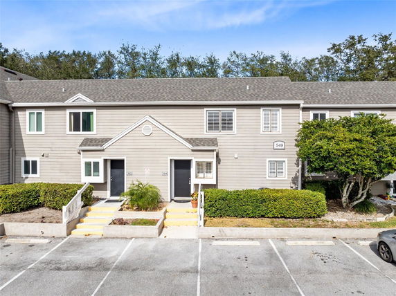Front view of a multi-unit townhouse building.