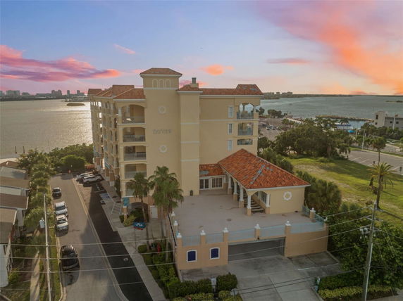 Front view of a multi-story building near the water.