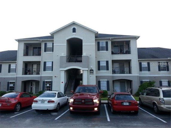 Front view of a three-story apartment building.