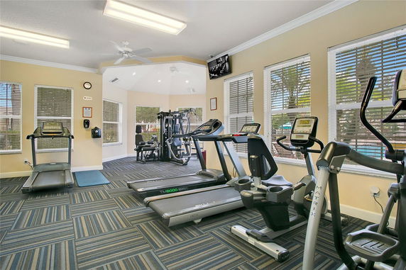 Interior view of a fitness area with treadmills and exercise equipment.