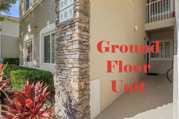 Front view of a ground floor unit with stone column and entrance.