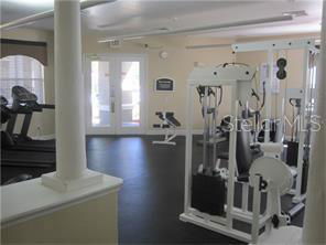 Interior view of a gym with exercise equipment and treadmills.