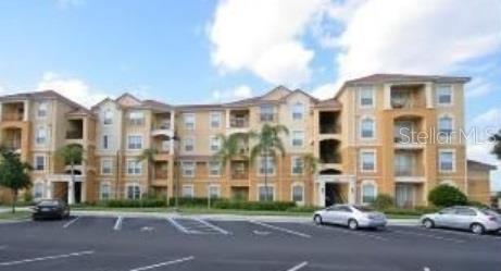 Front view of a multi-story apartment building with balconies.