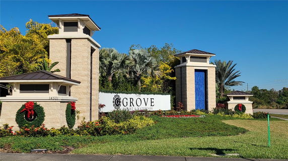 Entrance with tall pillars and a sign for The Grove Resort & Waterpark.