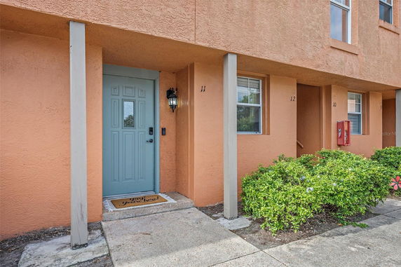 Front view of a building entrance with a blue door.
