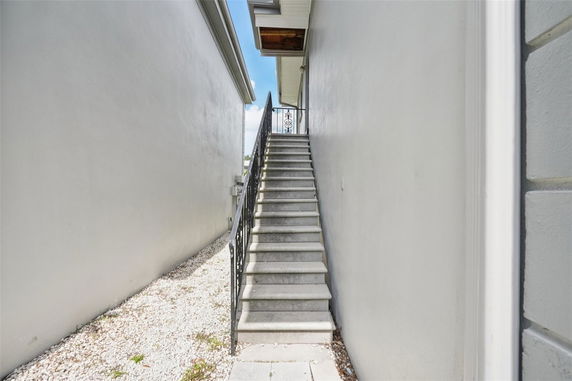 Outdoor staircase leading to a building entrance on the upper level.