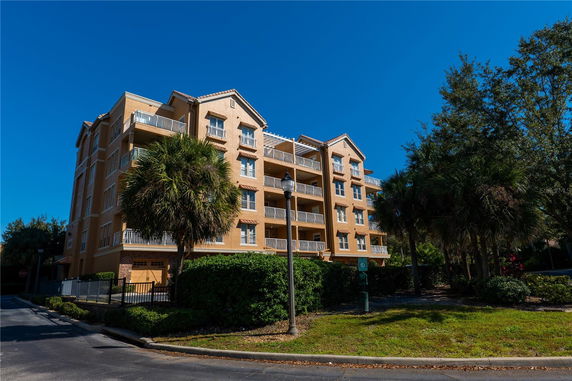 Front view of a multi-story residential building with balconies.