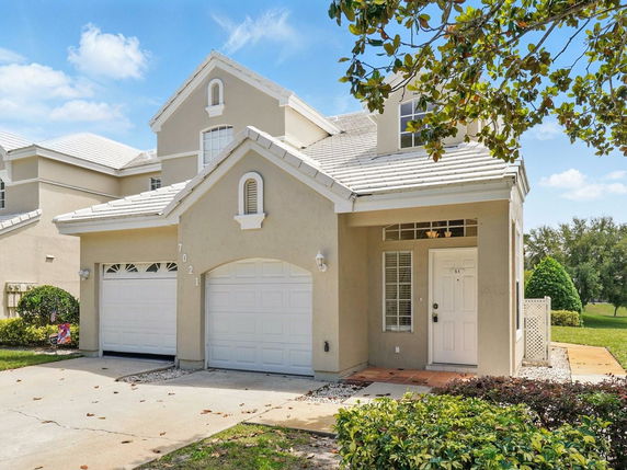 Front view of a two-story house with a double garage.