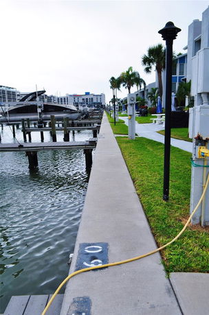 View of waterfront area with boats docked near buildings.